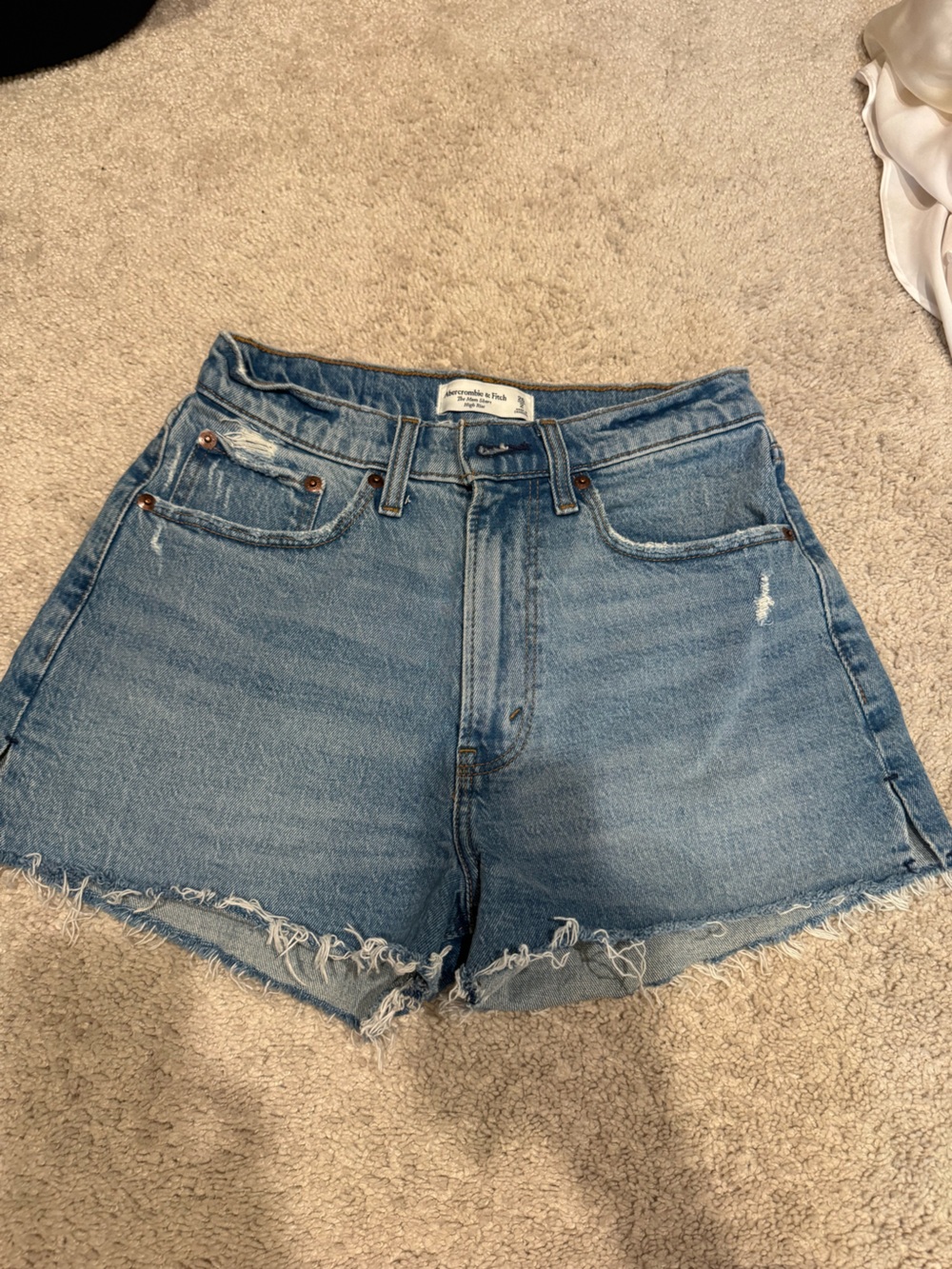 High-Rise Light Blue Distressed Denim Shorts